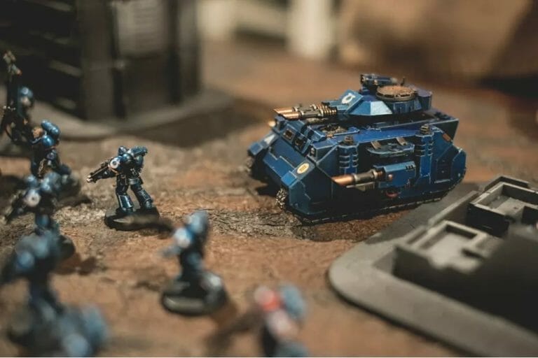 A group of blue warhammer soldiers on a table, perfect for Wargame Modeling enthusiasts.