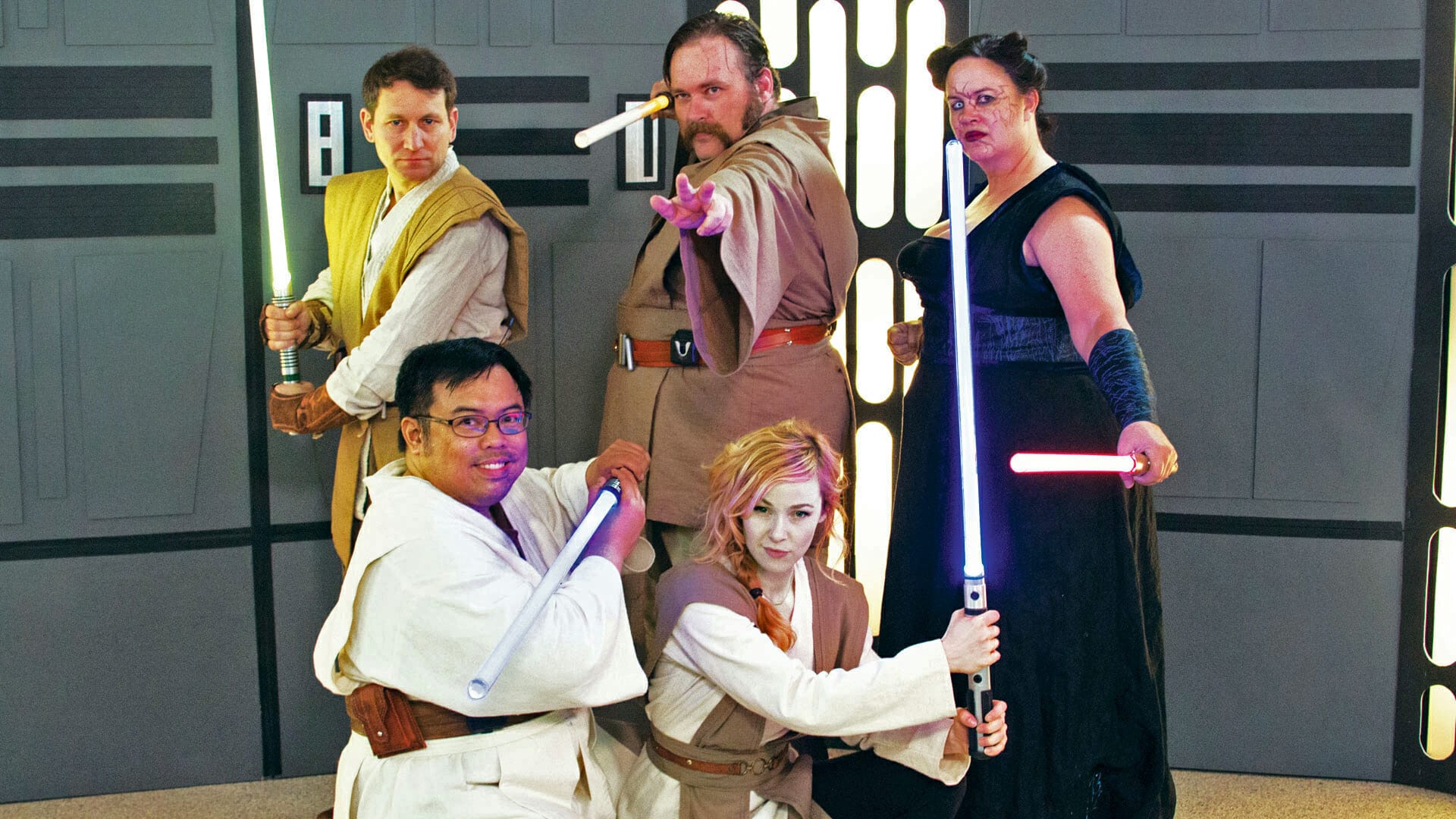 A group of Star Wars fans engaging in Beyond Geek Lightsaber combat.