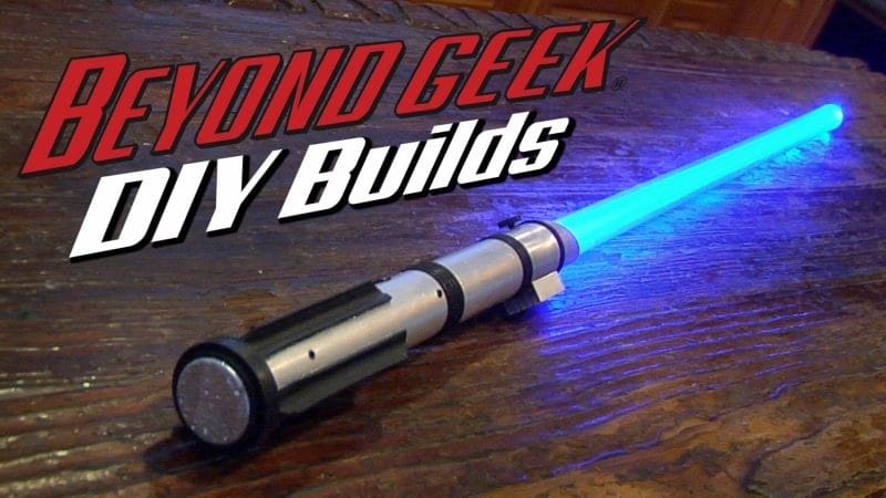 A Star Wars Lightsaber on a table.