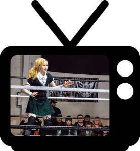 A woman in a kilt in front of a television.