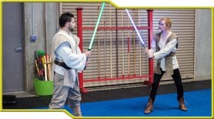 A couple of Star Wars fans showcasing lightsaber combat.