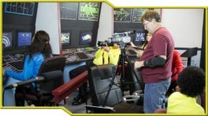 A group of people in a control room working on Project Potemkin for Potemkin Pictures.