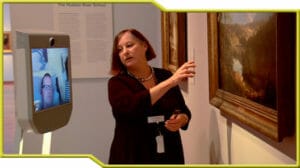 A woman pointing to a painting in the de Young Museum.